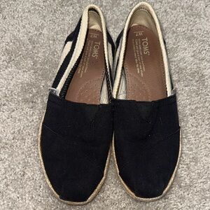 TOMS Black and Cream Canvas Slip-Ons